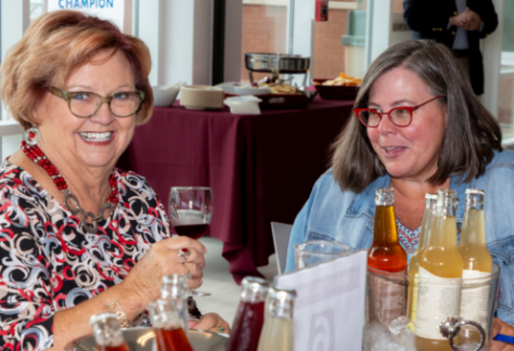 two women drinking wine at the wine expo