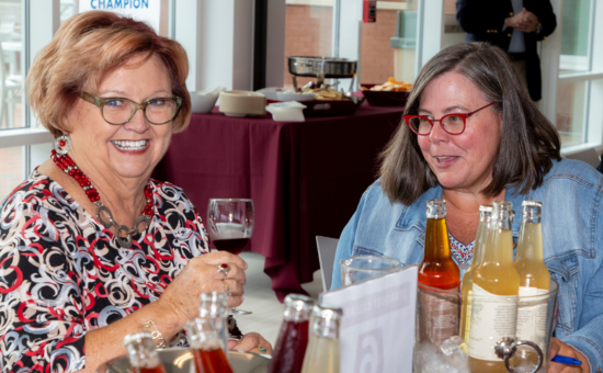 two women drinking wine at the wine expo