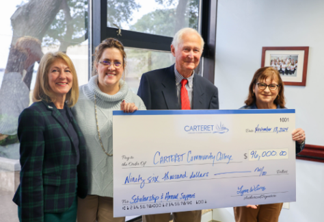 Lynn Eure Presents Check for Scholarships