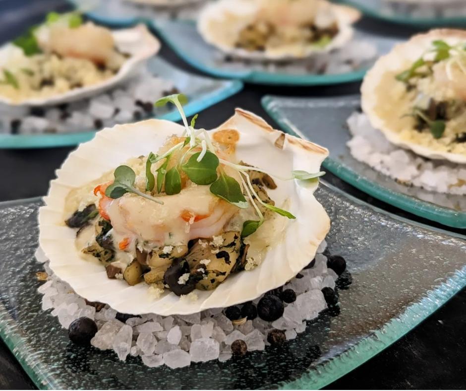oysters on a shell sitting on rock salt