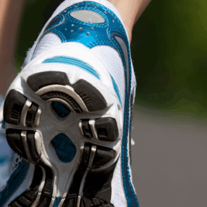 A picture of tennis shoes of someone walking