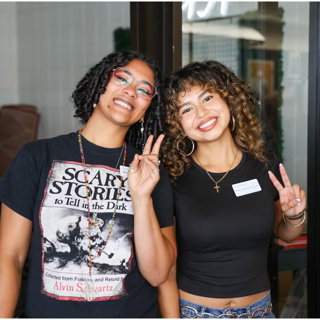 Two students smiling
