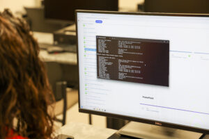 a student working on the computer using command line