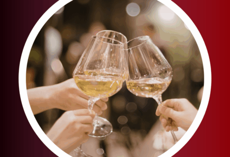 Close-up photo of three hands holding large wine glasses filled with white wine, clinking together in a toast. The background is softly blurred with warm lights, creating a festive and elegant atmosphere. The image is framed by a white circular border on a gradient background that fades from deep burgundy to red.