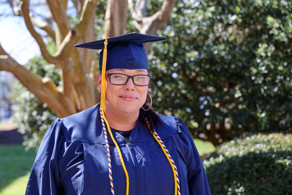 picture of a woman in her cap and gown for graduation