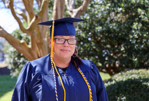 picture of a woman in her cap and gown for graduation