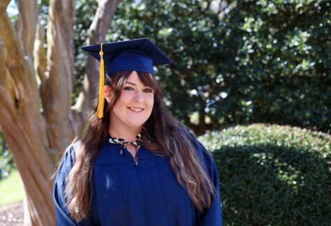 a female in her graduation cap and gown