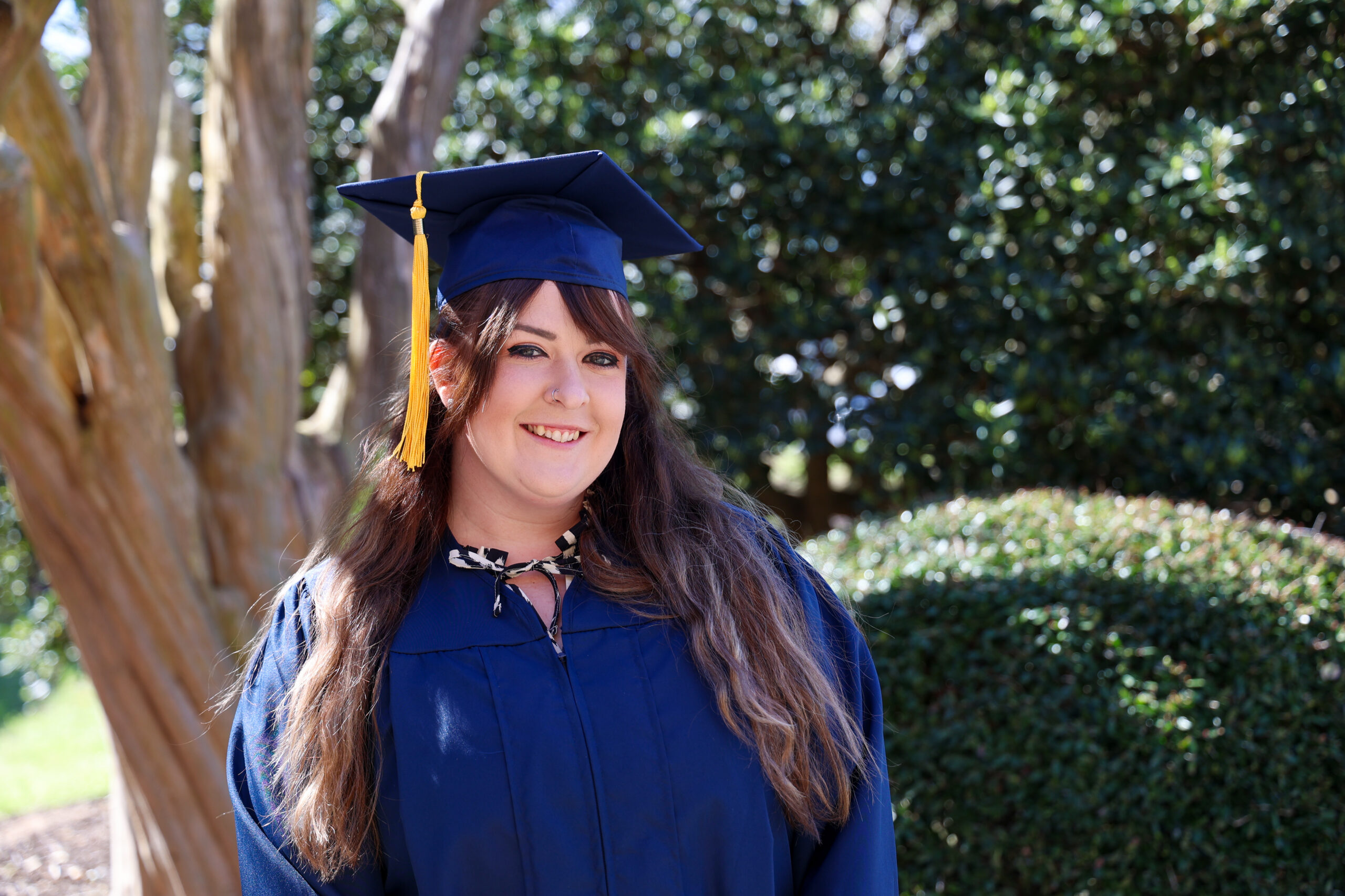 a female in her graduation cap and gown