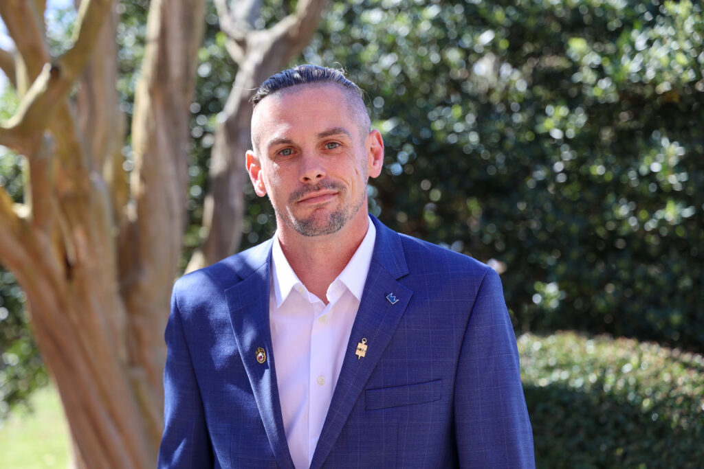 male student in a suite