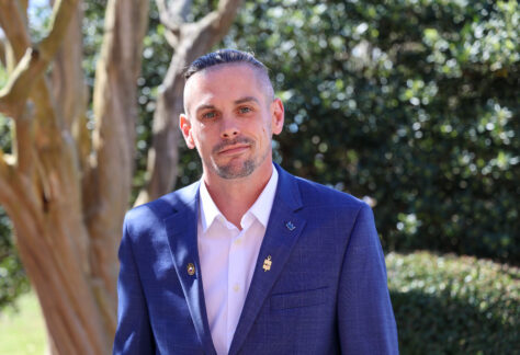 male student in a suite