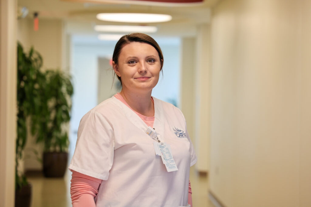 A female student in the hospital in her scrubs